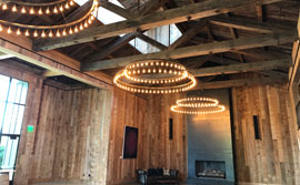 Wood detail of ceilings and siding with large light fixtures